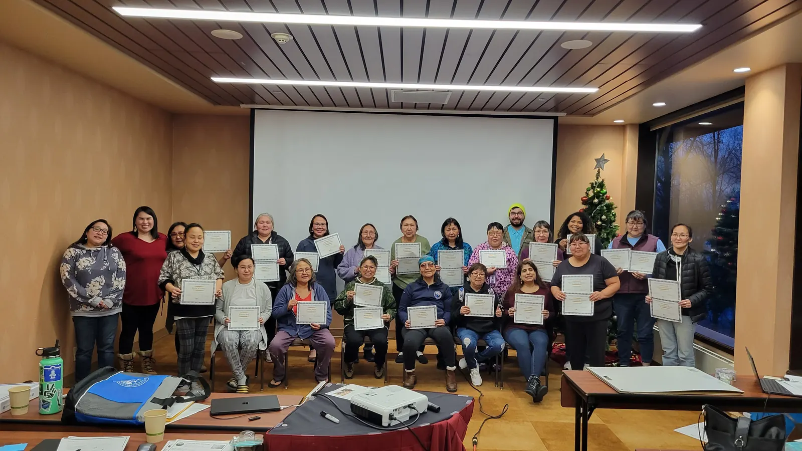 Training participants holding completion certificates